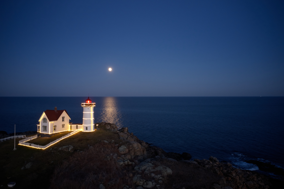 The Maine coast at dusk — many Maine wedding guests travel from out of state